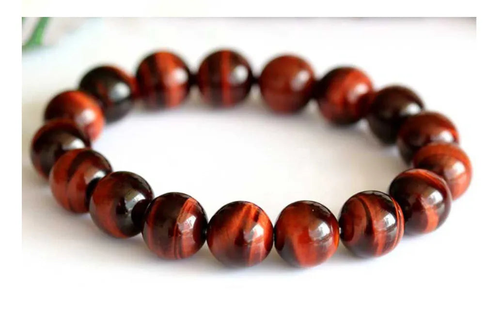 Wood alexandrite bracelet with red tigereye lightning cat's eye pattern and geometric round beads