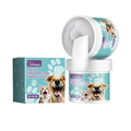 A dog dental cleaning glove with a detachable finger holder and a tube of cleaning paste on a blue background.