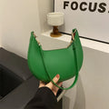Round green PU leather one-shoulder underarm bag with sewing line details and a shoulder strap