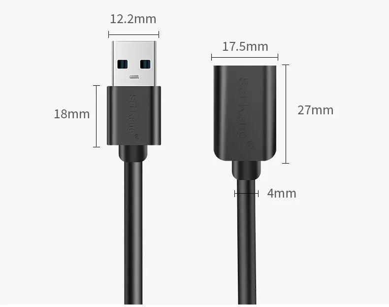 Black USB male to female extension cable on a desk, showing connector ends.