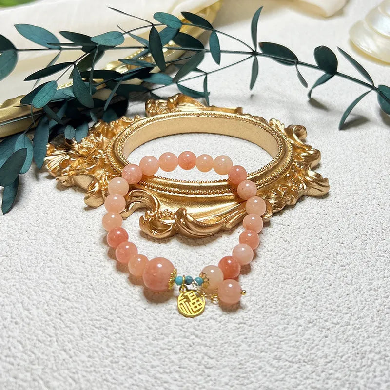 Pink natural stone bracelet on adjustable alloy chain for women, simple jewellery design