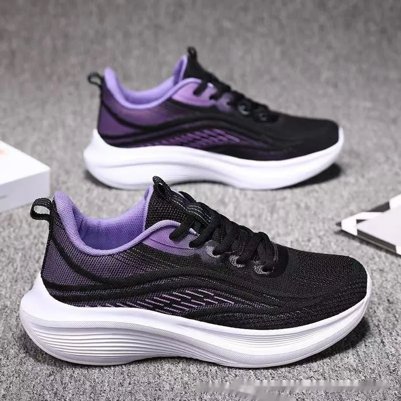 Women's low-top mesh running shoes in light pink with a round toe and front lace-up closure.