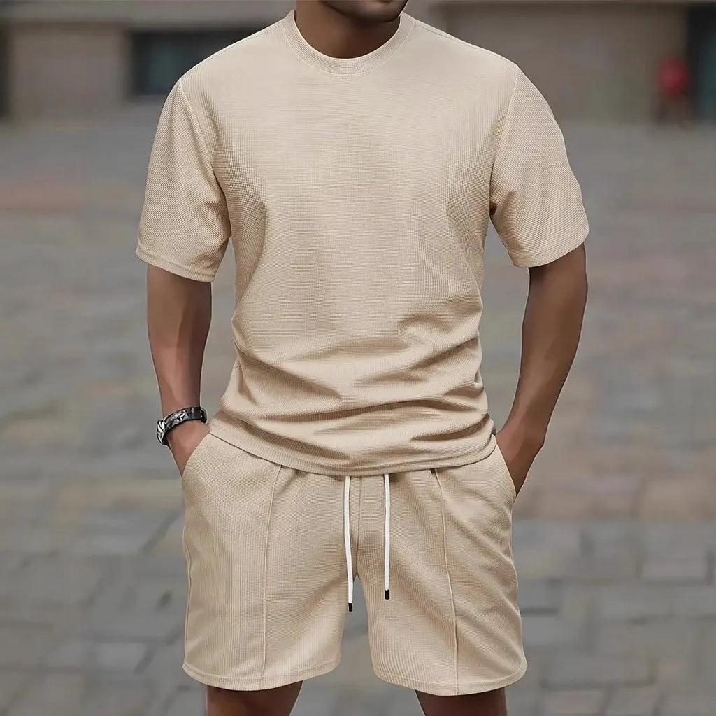 Man wearing a light apricot waffle texture short sleeve blouse and matching shorts for summer.