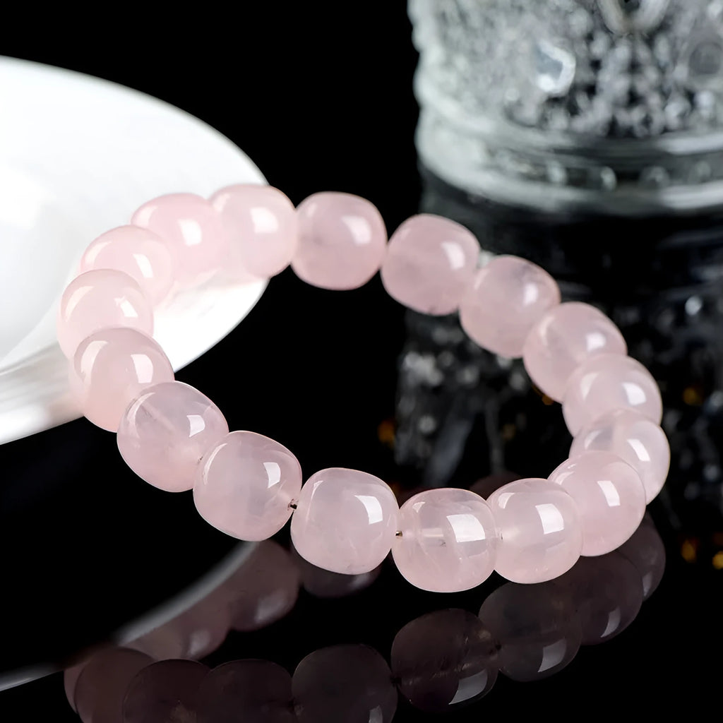 Pink unisex crystal bracelet with geometric barrel beads measuring 11-12 mm.