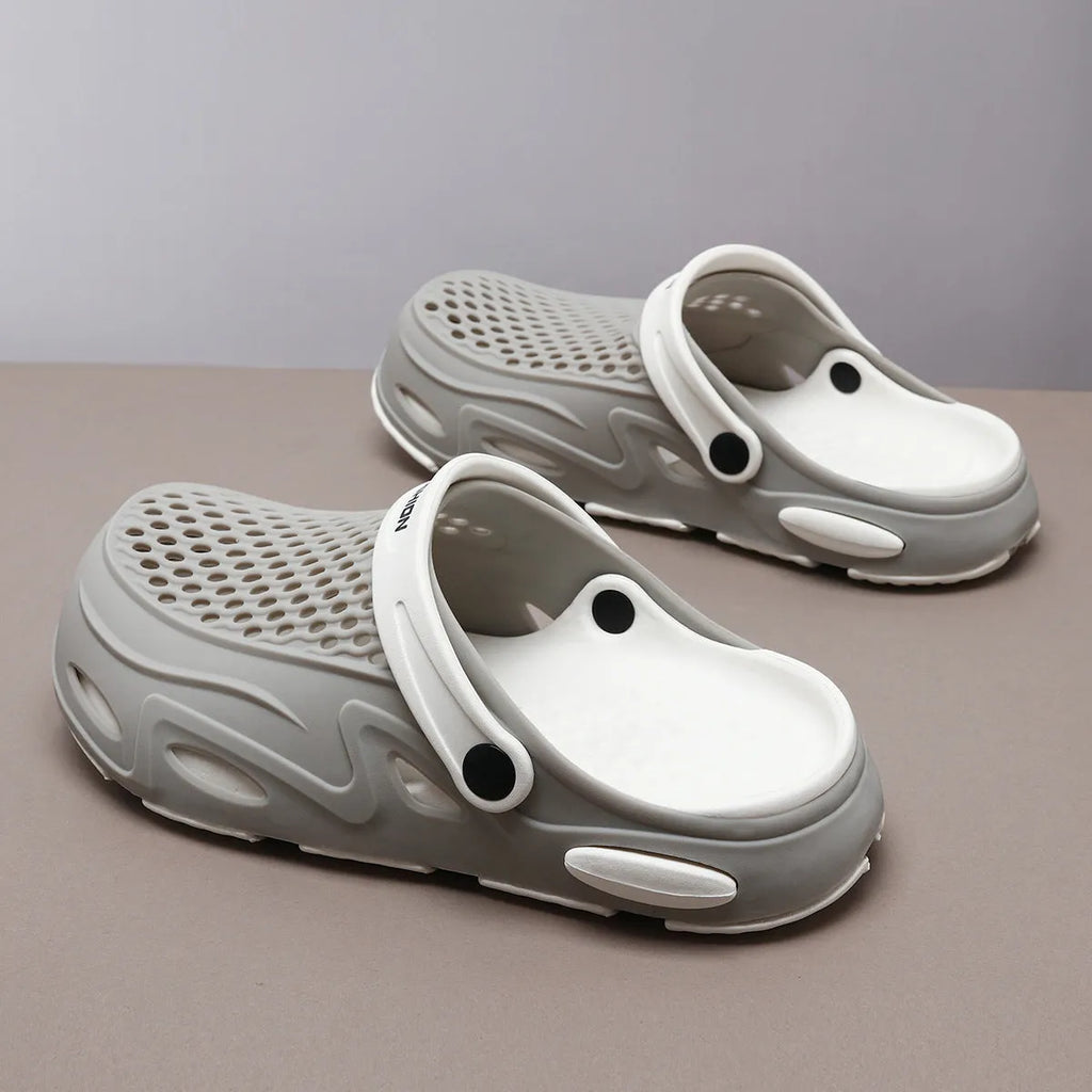 Men's closed toe beach slippers in gray colour showing grid pattern EVA construction with round toe design