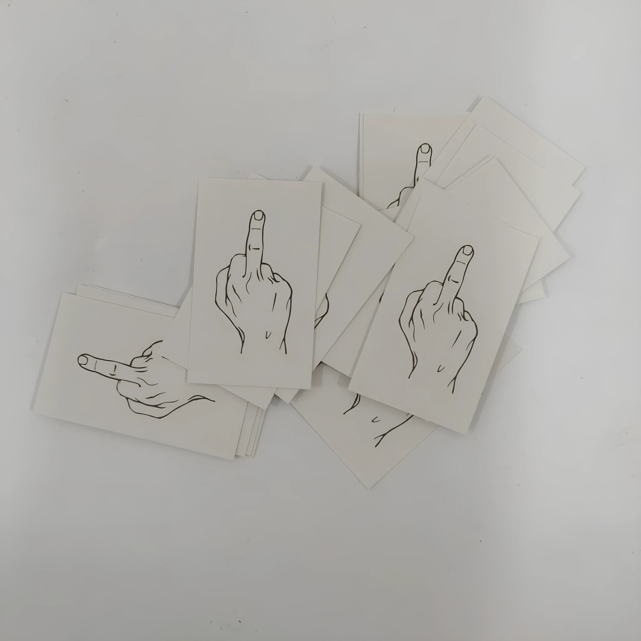 Box of paper illegal parking reminder cards showing a middle finger graphic.