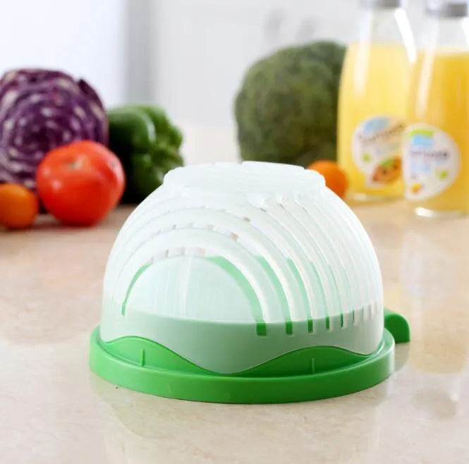 Blue salad cutter bowl showing removable cutting lid placed on a base with a raised rim.