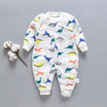 Baby wearing a long sleeve flannel romper with a printed panda pattern in pink and blue.
