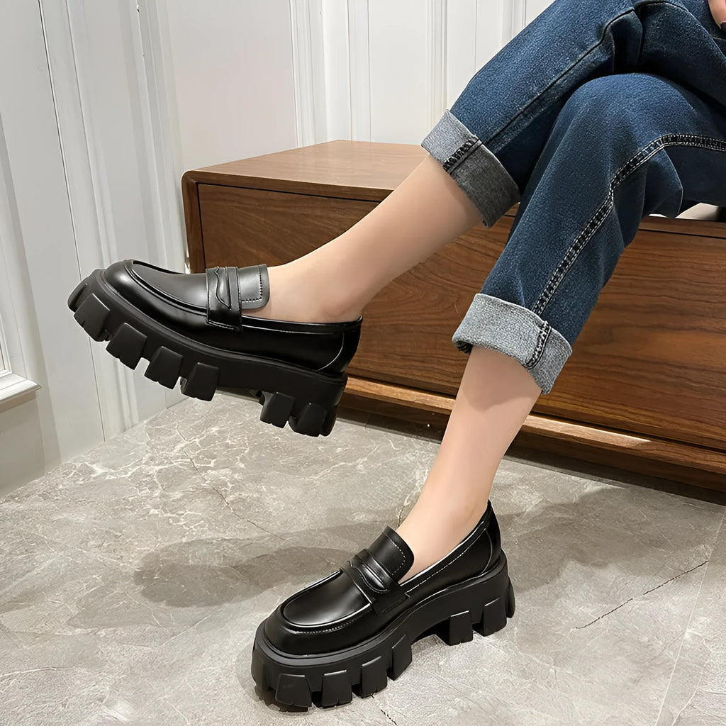 British style wide fit patent leather loafers with a rubber sole and muffin heel base.