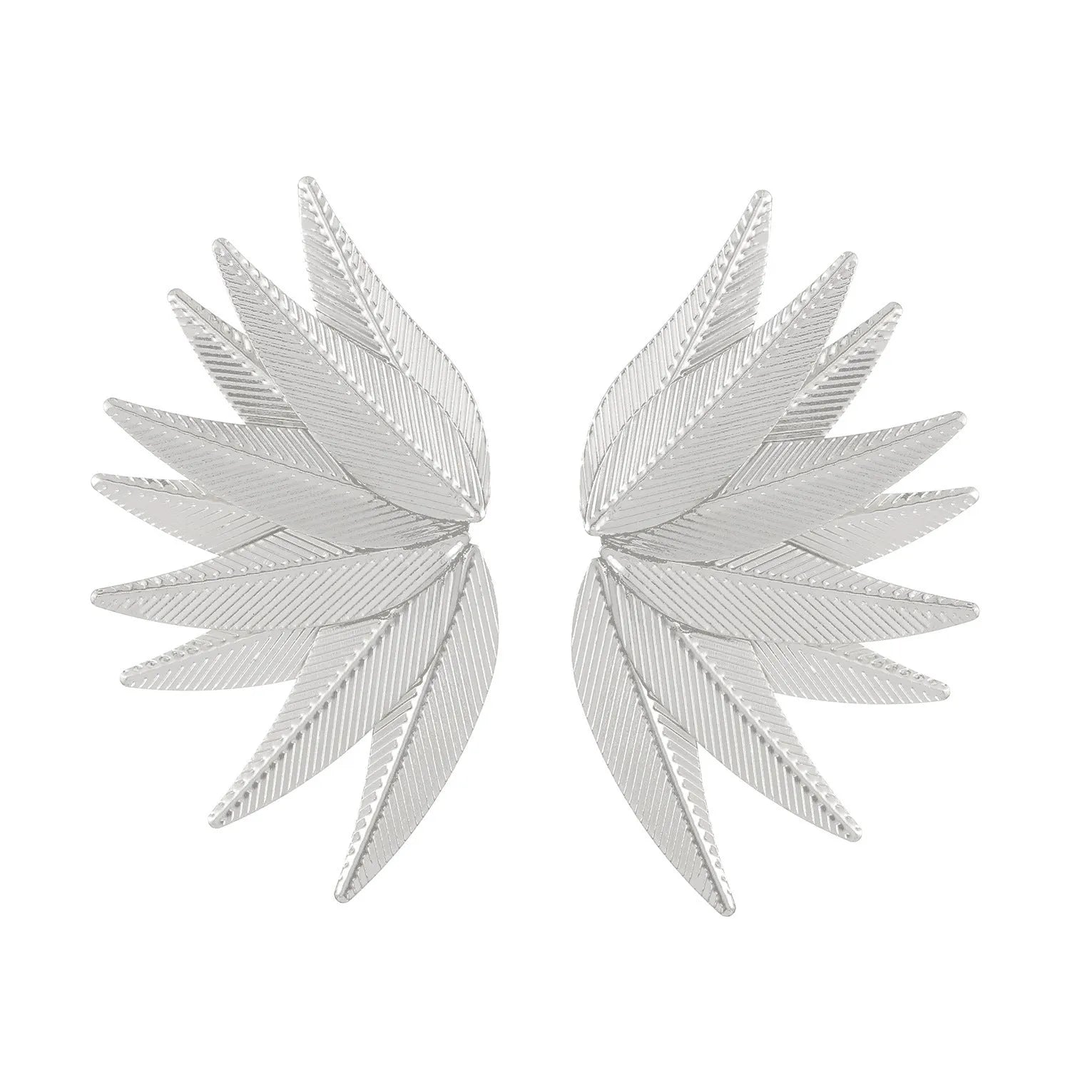 Gold and white alloy leaf shape patch earrings on a flat surface