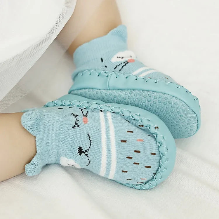 Pair of pastel coloured baby socks with anti-slip dots on the sole, shown flat.