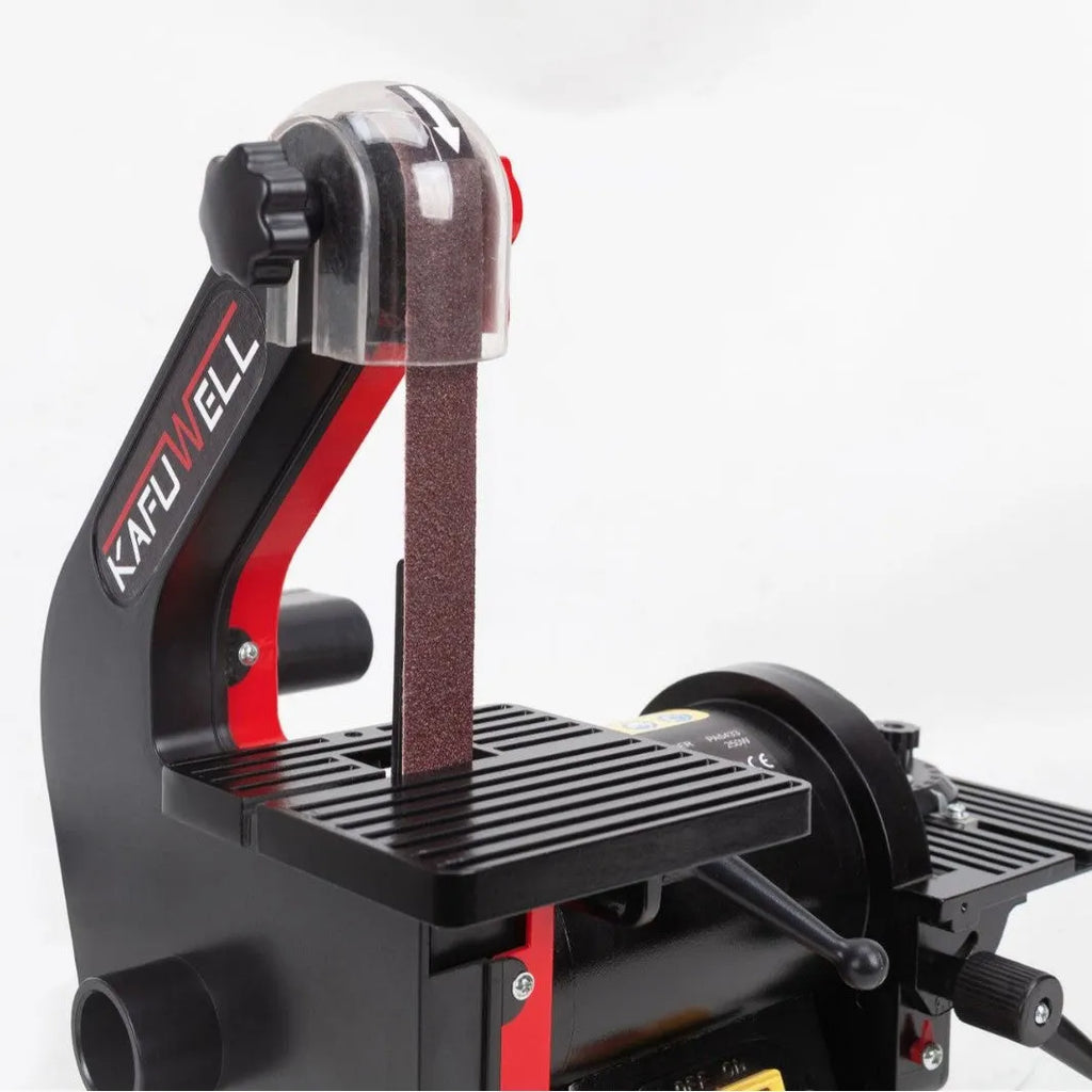 Small electric disc and belt sander for household use with EU plug and power cord on workbench