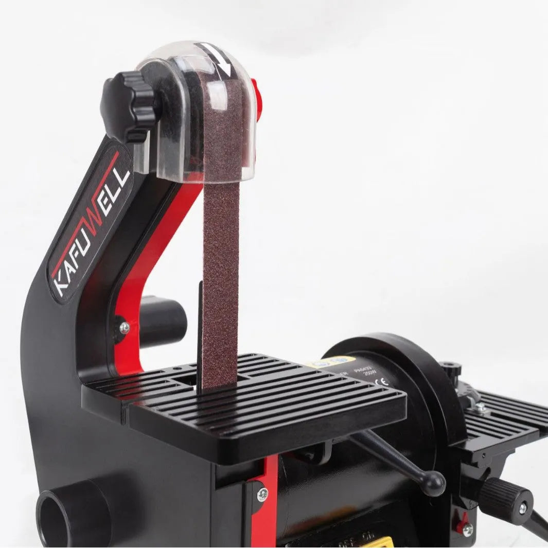 Small electric disc and belt sander for household use with EU plug and power cord on workbench
