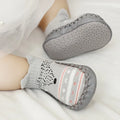 Pair of pastel coloured baby socks with anti-slip dots on the sole, shown flat.