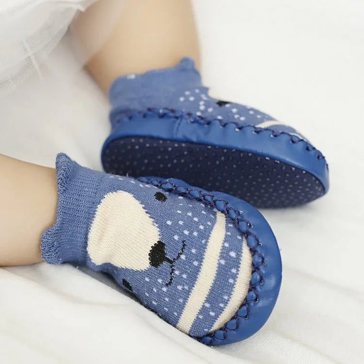 Pair of pastel coloured baby socks with anti-slip dots on the sole, shown flat.