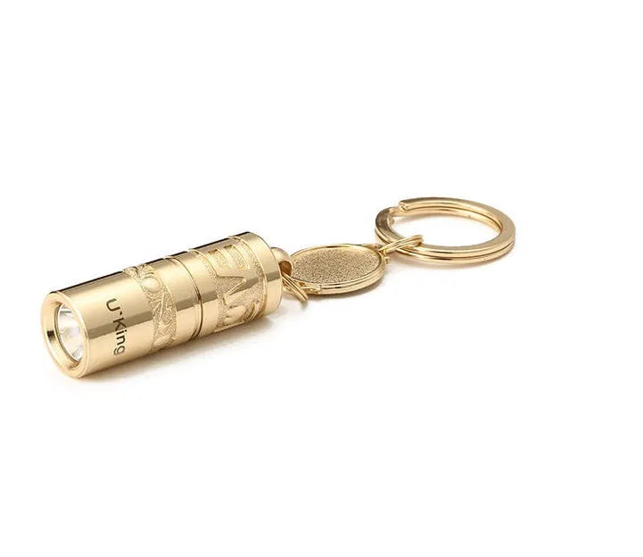 Gold-colour zinc alloy waterproof mini LED flashlight on a keychain ring.