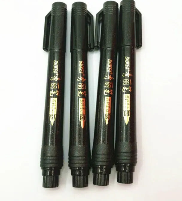 Set of four Japanese calligraphy brush pens and refills for ink drawing and sumi-e painting.