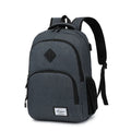 Light grey nylon backpack with USB charging port showing dimensions and trolley case attachment