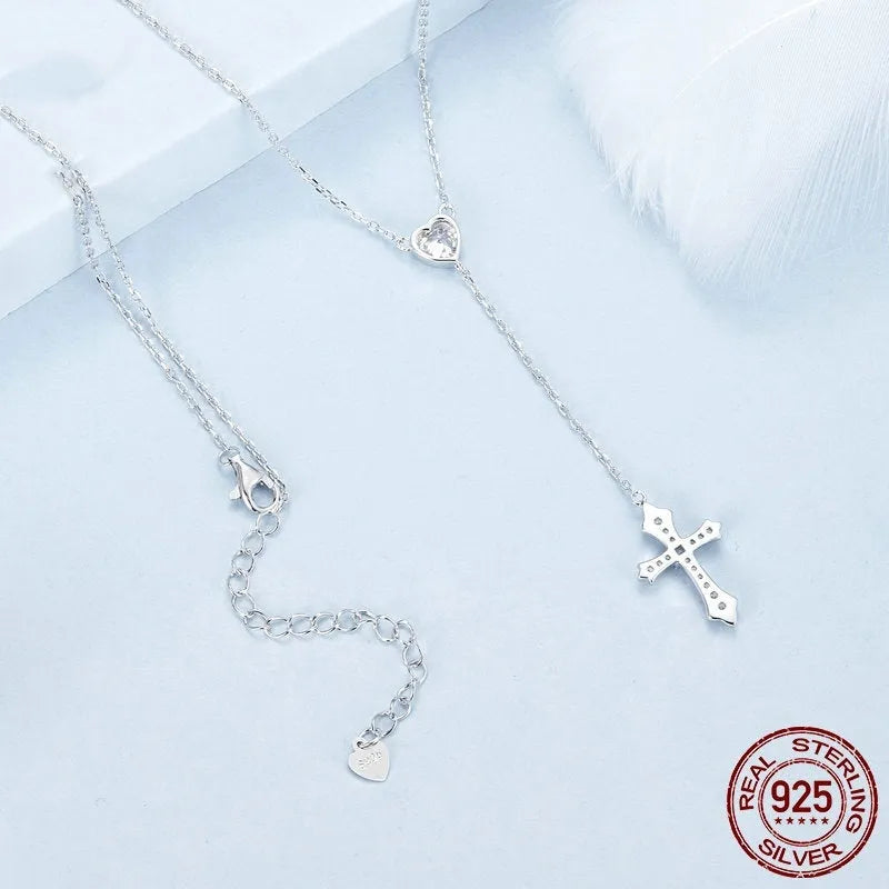 Silver Love Cross pendant necklace with O-ring chain on BSN384 colour background