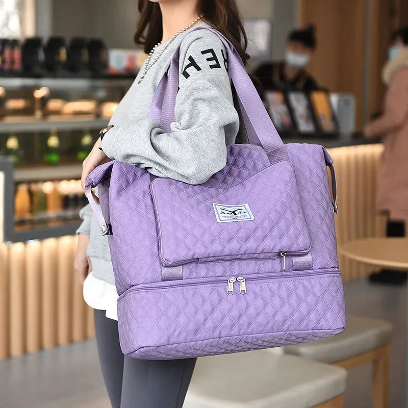 Foldable Oxford cloth travel duffle bag in solid colour with rhombus sewing design and shoulder strap