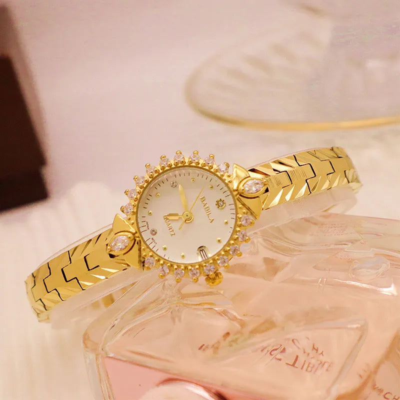 Women's vintage-style quartz watch with diamond-embossed gold bracelet