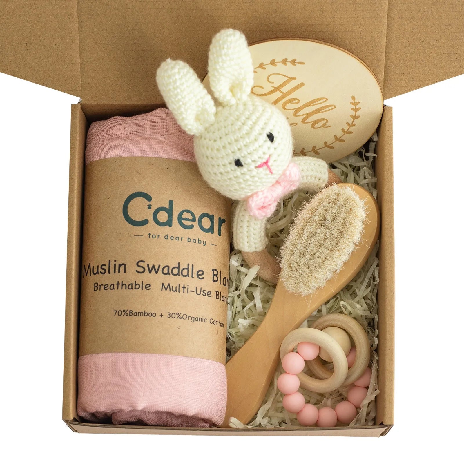 Baby teething toy gift set showing gauze blanket, wooden bell, gum teether, tire brush, and milestone on white background