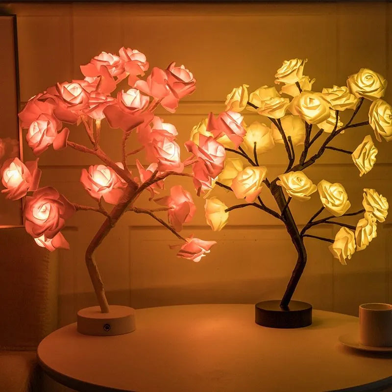 White and red rose flower shaped USB battery LED table lamp with warm white light on a table