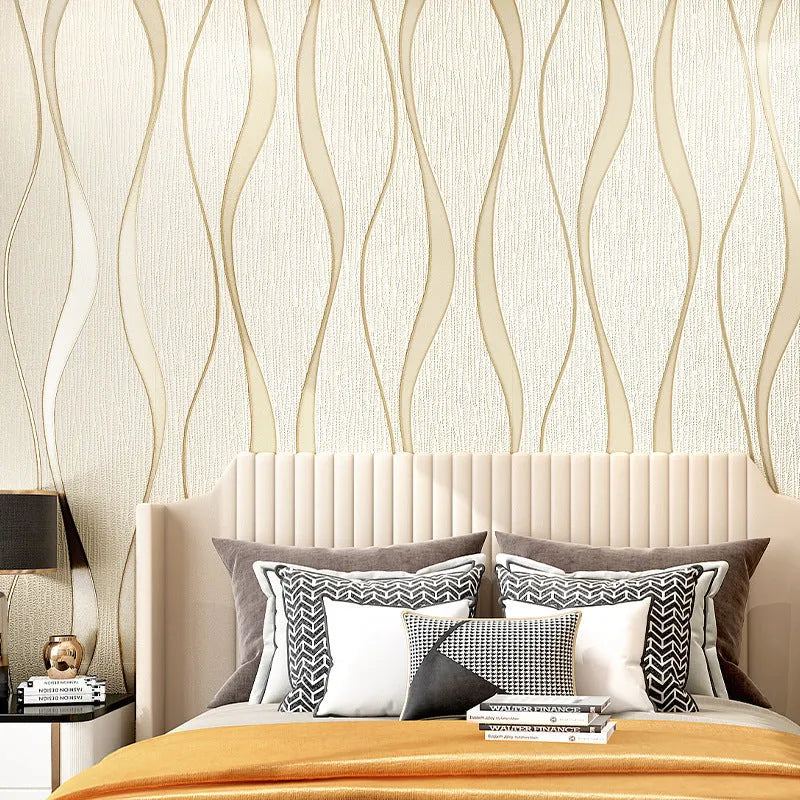 Roll of grey 3D stripe wallpaper with thick velvet texture next to a sample on a wall