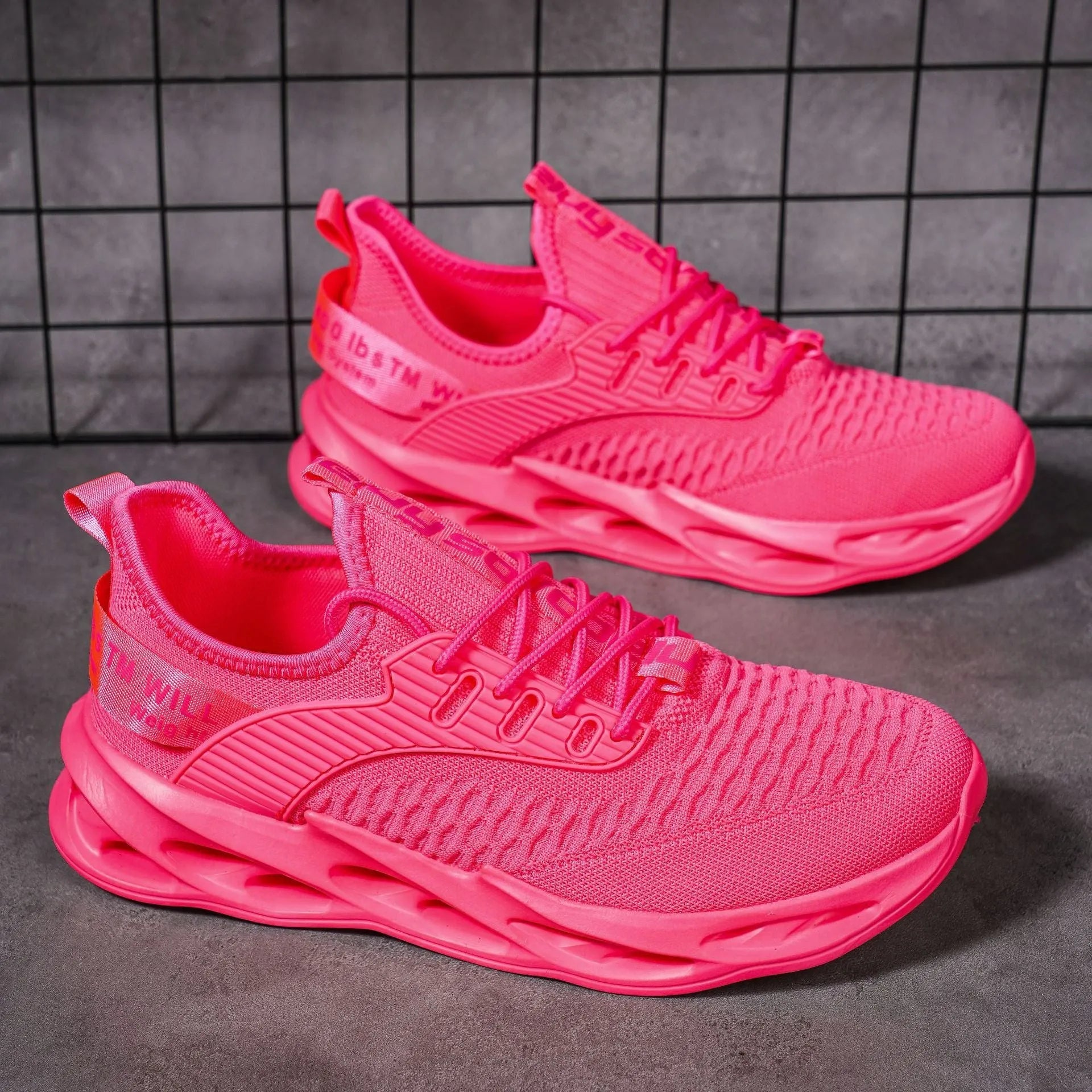 Women's casual FlyKnit shoe in a solid colour, showing mesh upper, round toe, and flat heel.