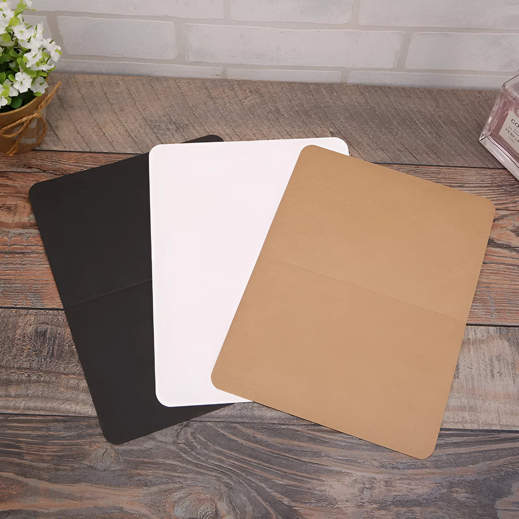 Pack of 100 folded kraft paper greeting cards in 10x15cm size, showing black, brown, and white colour options.