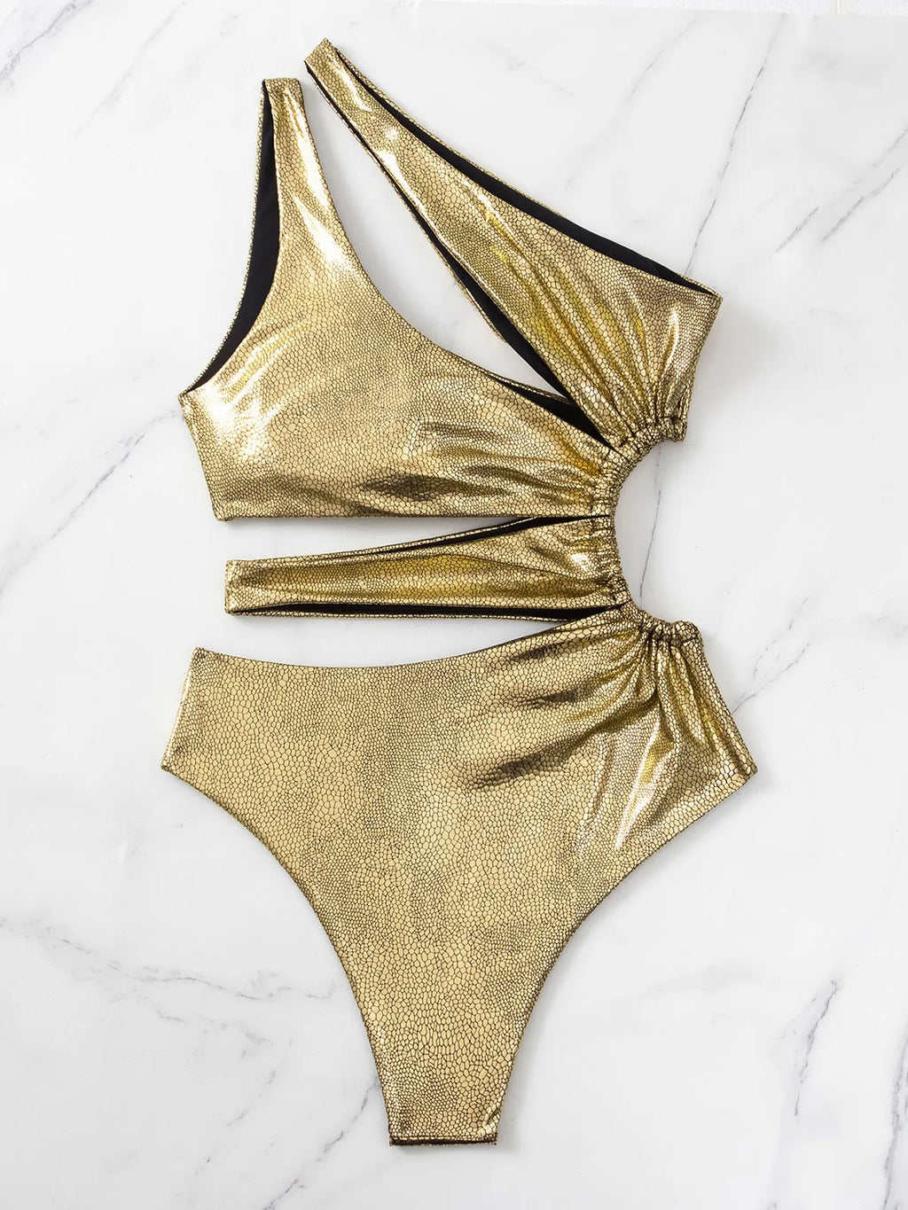 Gold women's one-piece swimsuit with backless design and spandex construction
