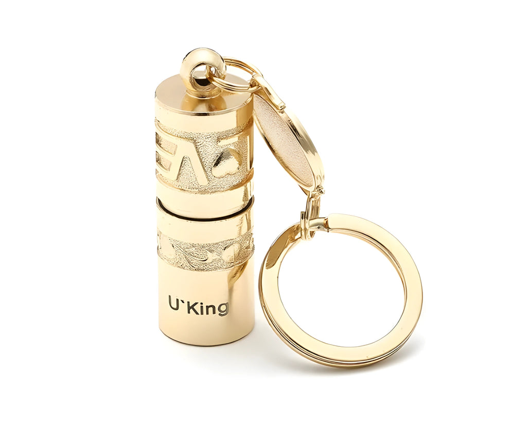 Gold-colour zinc alloy waterproof mini LED flashlight on a keychain ring.