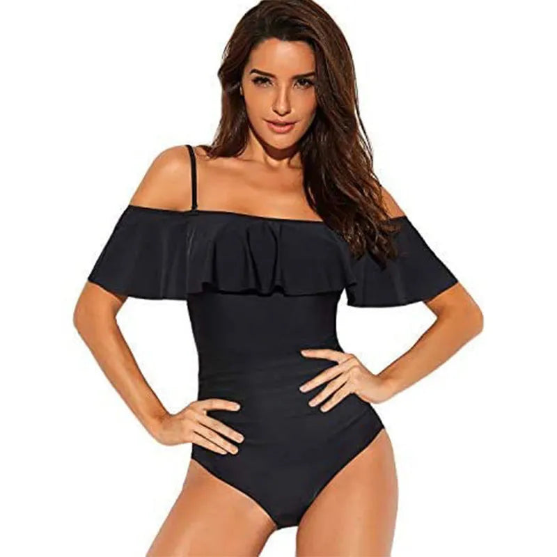 Black one-piece swimsuit with cut-out detail and ruffled strap tube top.