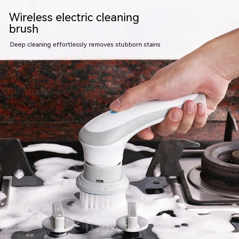White handheld electric cleaning brush with rotating brush head on bathroom tiles