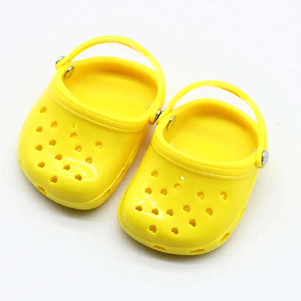 Plastic doll beach slippers in four colours: blue, red, yellow, green