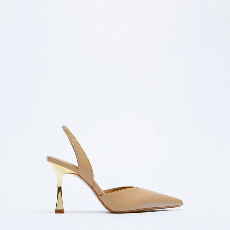 Women's pointed-toe patent leather high heels in nude colour with a shallow-cut vamp.