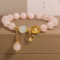 Women's pink crystal flower charm bracelet with delicate floral design