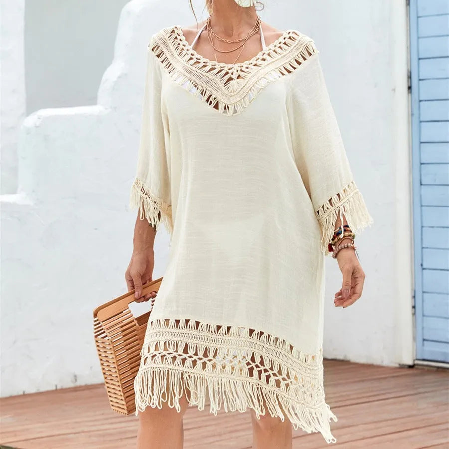 Apricot crocheted knitted patchwork beach dress with half sleeves on a hanger