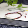 Red garnet and natural agate beaded bracelet with pull-adjustable closure on wrist