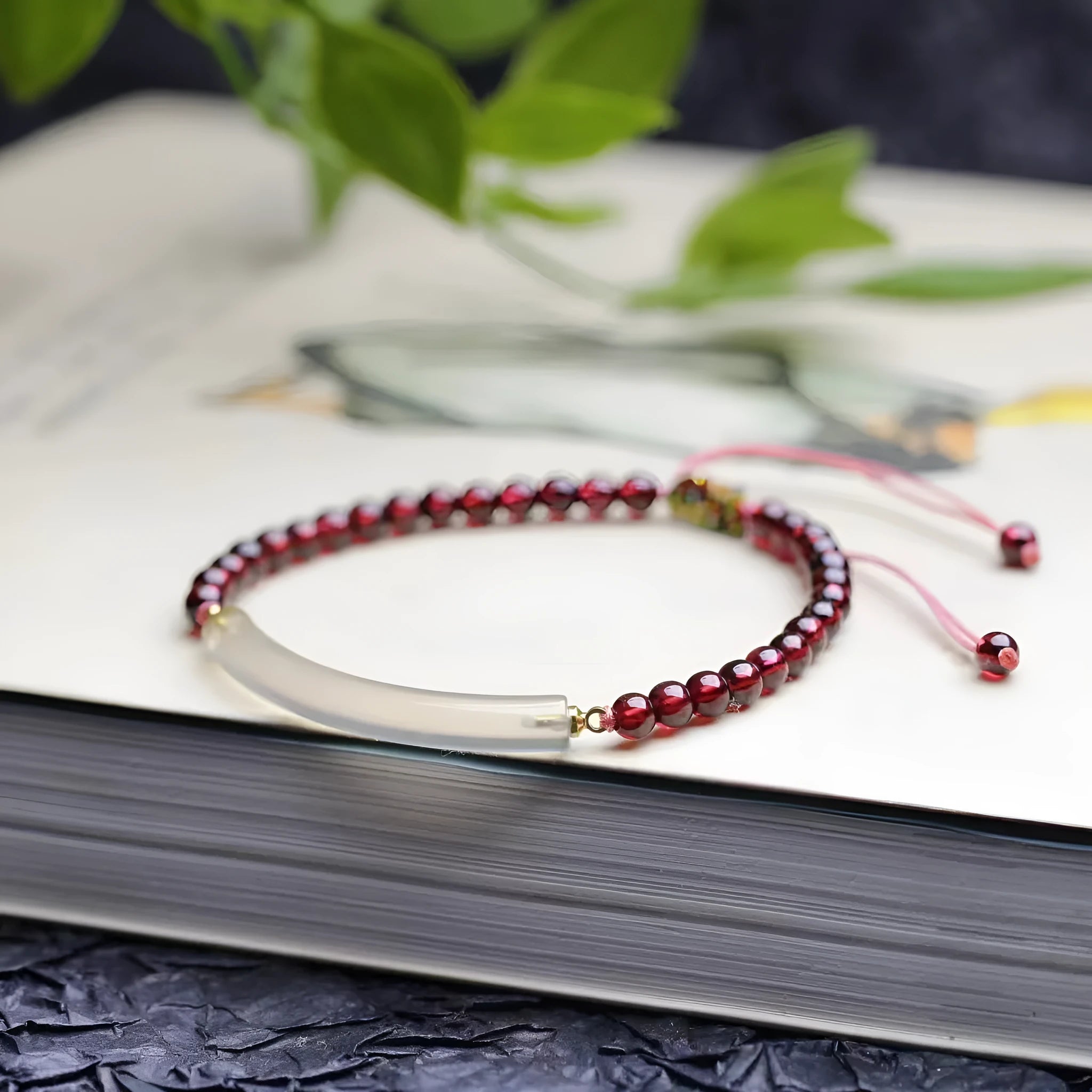 Red garnet and natural agate beaded bracelet with pull-adjustable closure on wrist