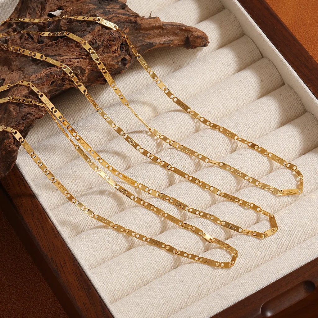 Gold electroplated titanium steel necklace with hammer pattern and Chinese character pendant on a stud chain