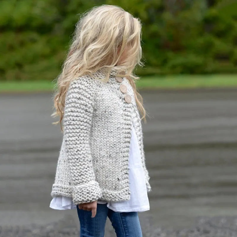 Beige long sleeve girls cardigan sweater coat with single-breasted button closure.