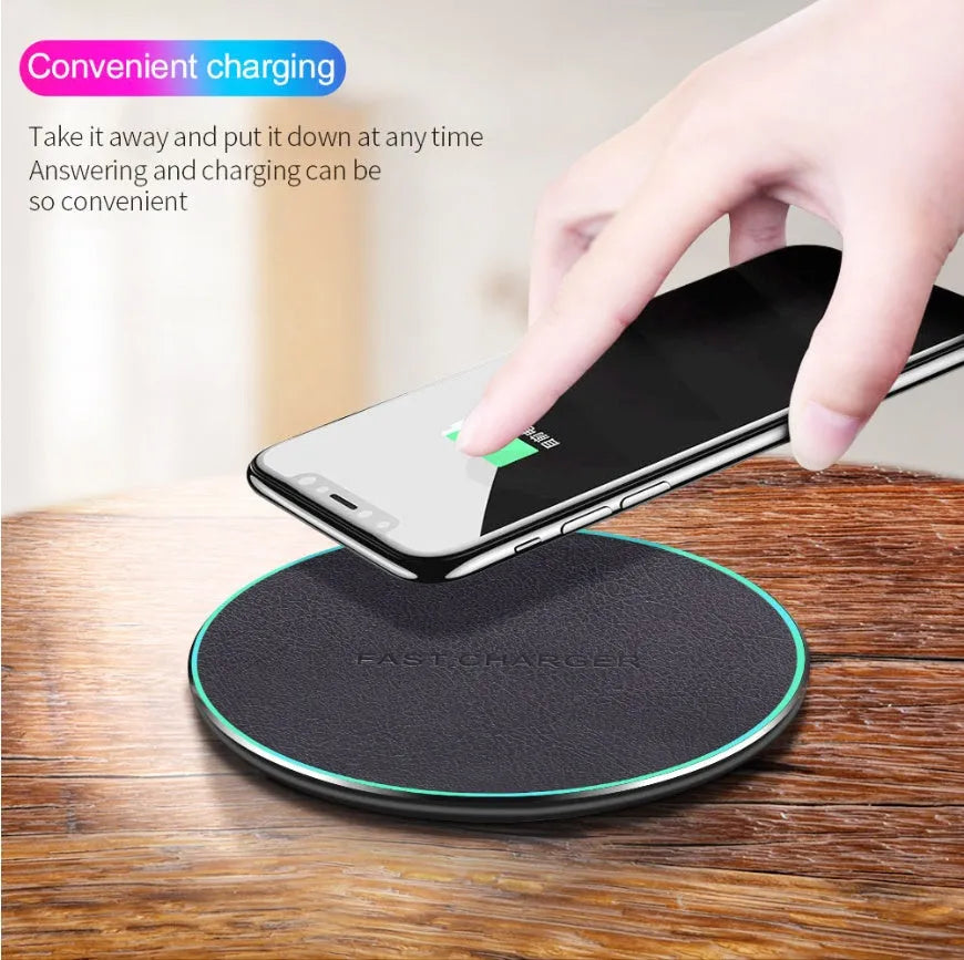 Black Qi wireless charging pad for iPhone 11 showing aluminium casing and silicone charging surface
