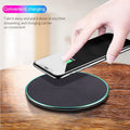 Black Qi wireless charging pad for iPhone 11 showing aluminium casing and silicone charging surface