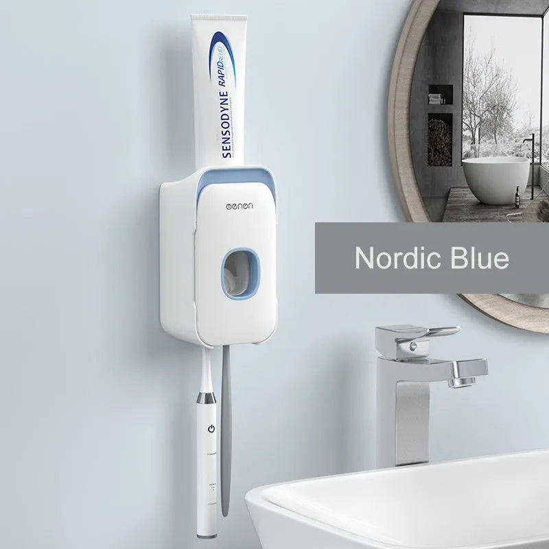 Blue, grey, and pink automatic toothpaste dispenser made of ABS plastic for wall mounting