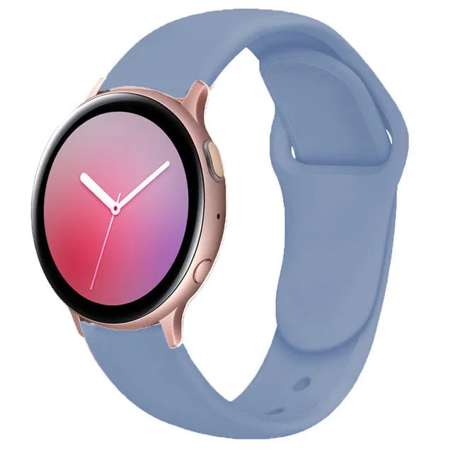Samsung Galaxy Active 2 watch with a purple reverse buckle silicone strap on a wrist.