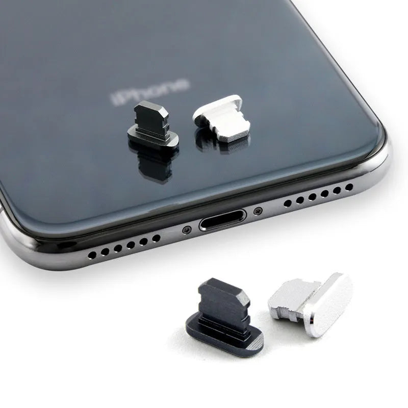 Aluminium alloy charging port dust plug for iPhone in various metallic colours including gold and rose gold.