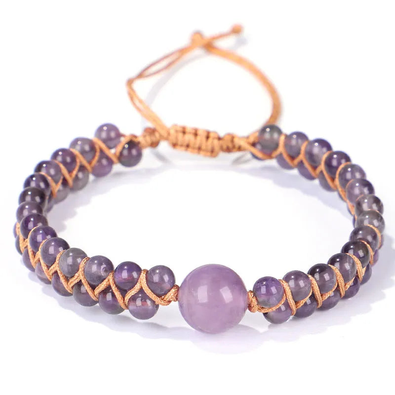 Close-up of a handmade geometric bracelet woven with blue Tigereye stone beads, showing its textured pull-on design.