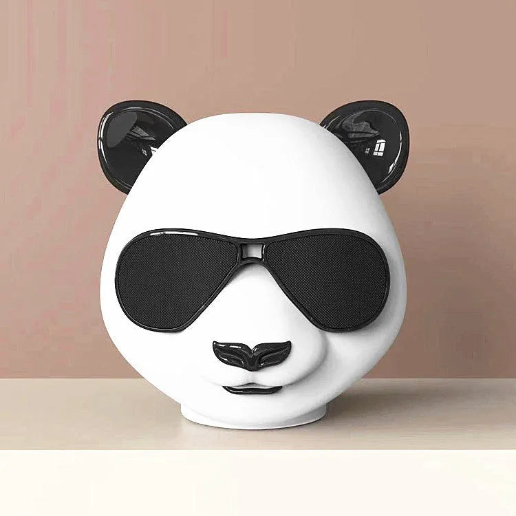 Portable mini Bluetooth speaker in a classic style design showing front grille.