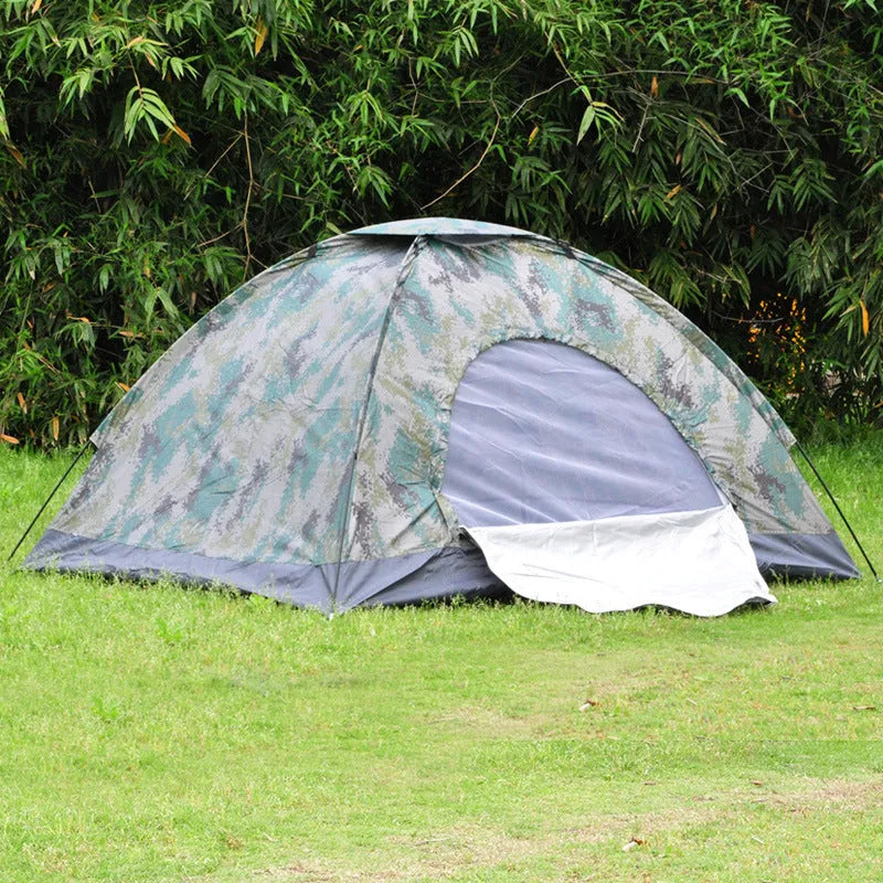Green camouflage two-person tent with mesh windows and triangular skylight, shown erected outdoors.